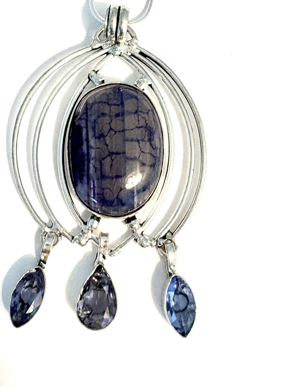 3 inch, 925 marked, Solar Agate and Blue Topaz pendant on a silver chain.